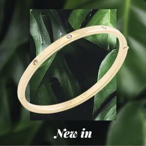 Coach Gold Tone Bangle Bracelet with Crystal Accents